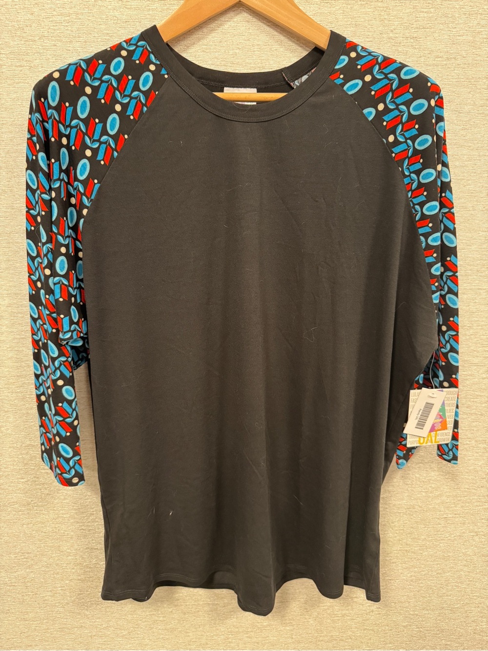 LuLaRoe Black Raglan Tee (Randy) with Red & Blue Geo Sleeves